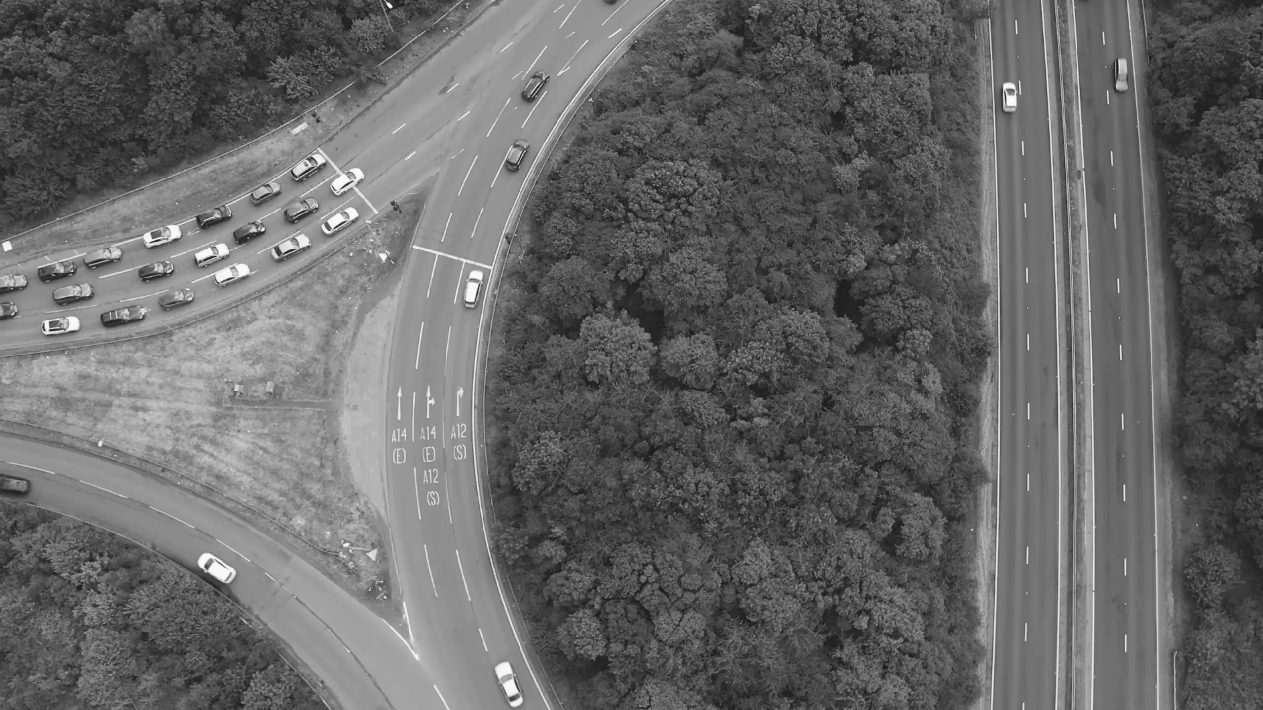 Cinematic drone still showing traffic merging onto the A12
